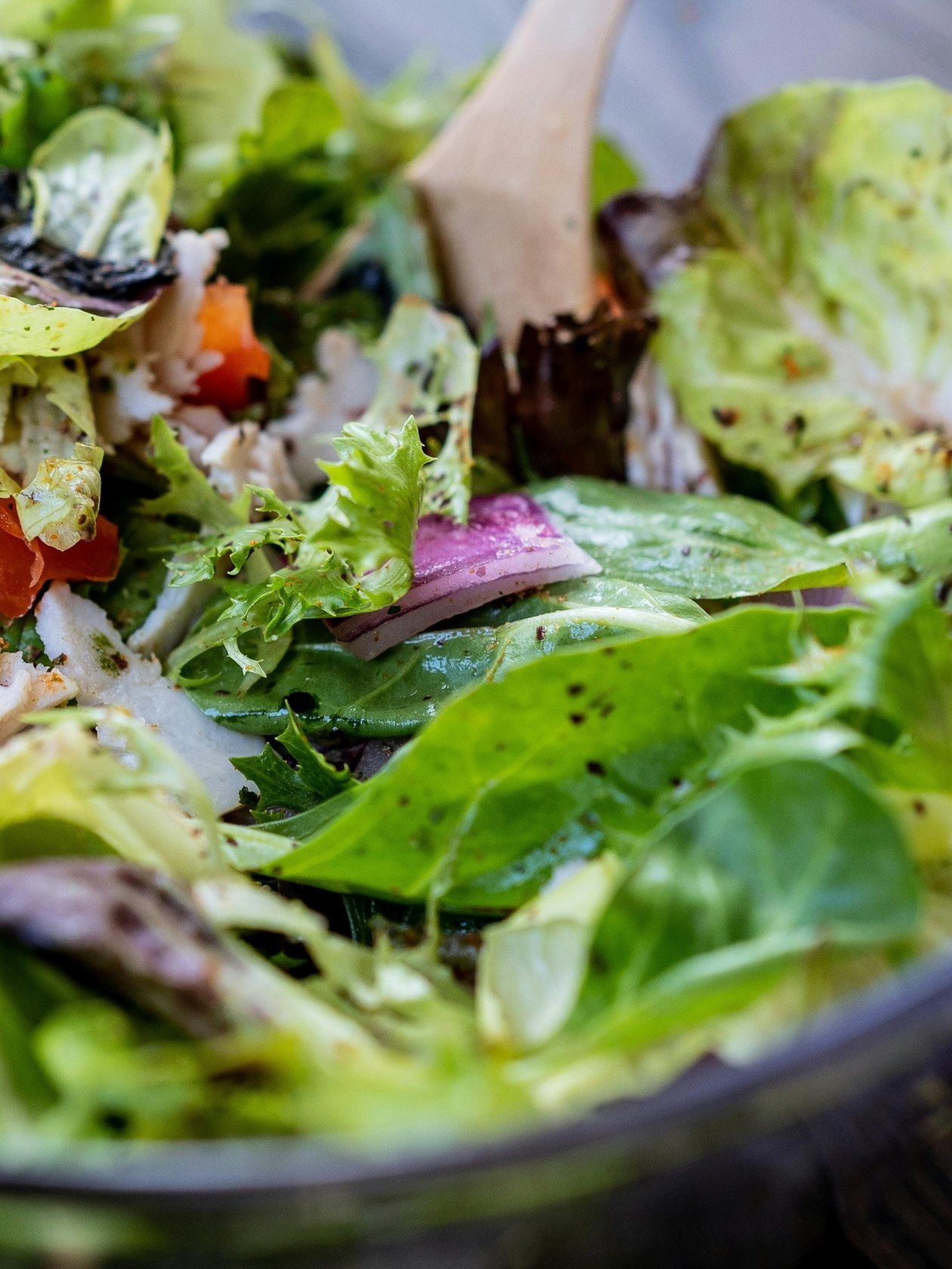 Fresh Salad Bliss A bowl of mixed salad featuring lettuce, tomatoes, and onions for healthy eating